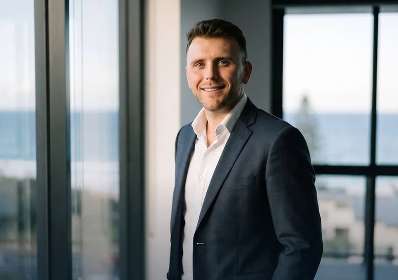 Sam Gardiner on the phone at his desk, Caloundra